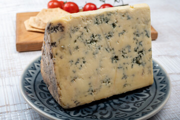 Cheese collection, English semi-soft, crumbly old stilton blue cheese close up