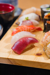 Japanese food - Sushi set on a wooden plate, selective focus