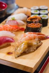 Japanese food - Sushi set on a wooden plate, selective focus