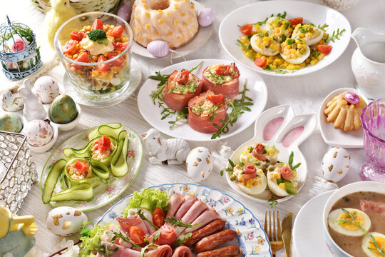 Easter breakfast with vegetable salads, cold cuts and deviled eggs