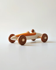 retro wooden toy racecar on a white background.