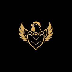 Obraz premium A gold eagle logo incorporating a defense concept, conveying a sense of sturdiness, strength, elegance, modernity, luxury, and boldness for the company