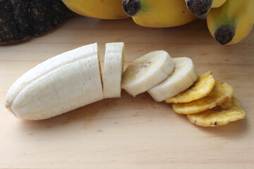 Sliced ​​banana and banana chips isolated.