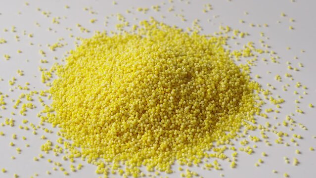 Background of raw millet seeds close up. Millet seeds texture.