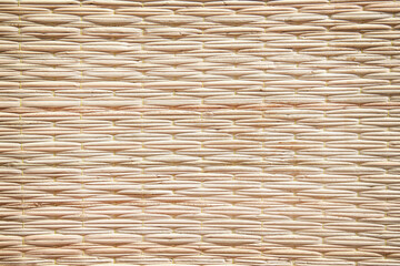 Obraz premium Weaving straw mat horizontal light brown background with seamless patterns