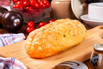 Garlic butter cheese bread on cutting board 