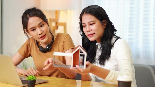home owner, moving home. Woman lesbian couple plan buy for new house. Professional real estate agent or insurance sales. Mortgage property insurance. New home, successful deal meeting