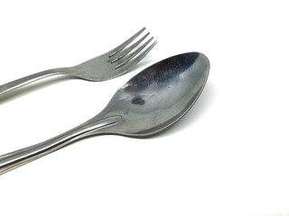 stainless steel spoon and fork on isolated background