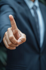 Young businessman wearing suit over office background Pointing with finger up and angry expression, showing no gesture