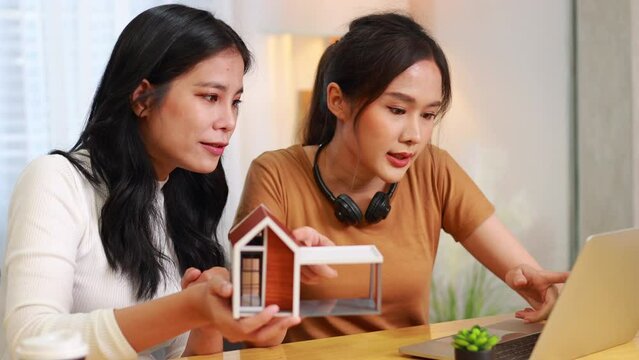 home owner, moving home. Woman lesbian couple plan buy for new house. Professional real estate agent or insurance sales. Mortgage property insurance. New home, successful deal meeting