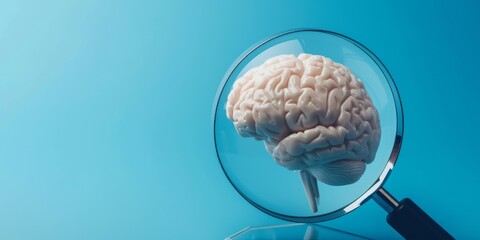 Magnifying glass and human brain on blue background, mental health care concept.
 - obrazy, fototapety, plakaty