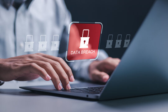 Data breach and hacker attack concept. Person use laptop with virtual red padlock icon for information leak. data protection, firewalls, privacy measures, and access information.