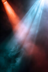 Colorful stage lights with smoke and rays of light on black background