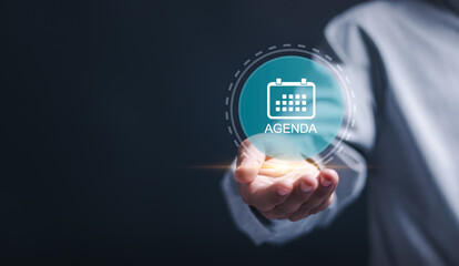 Agenda meeting appointment activity information concept. Businessman holding virtual Agenda icon for agenda meeting plan schedule in personal organizer. - obrazy, fototapety, plakaty