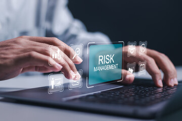 Businessman use laptop with virtual icon of Risk analysis in business decisions. Risk control and management strategies for risky businesses, Risk management concept. - obrazy, fototapety, plakaty
