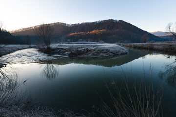 horse shoe of small Bednja river covered in frost in early winter morning 