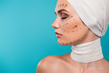 Photo of atractive lady in medical bandage prepare for beauty plastic operation over cyan color...