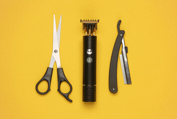 Barber working tools on a yellow background. Layout. Flat lay. Top view