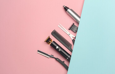 Barber working tools on pink blue background. Layout. Flat lay. Top view
