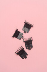trimmer attachments on a pink background