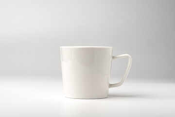 Blank white coffee mug mock up on white background