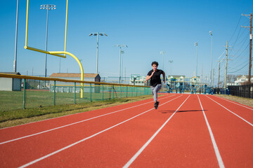 Young asian guy running