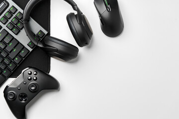 Top view of gamer table with computer keyboard, joystick and headphones © fotofabrika