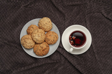 Breakfast in bed. Food on a dark blanket. Top view
