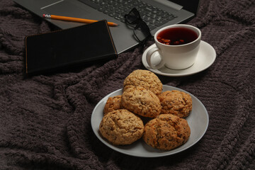 Laptop and breakfast in bed. Freelancing, business from home