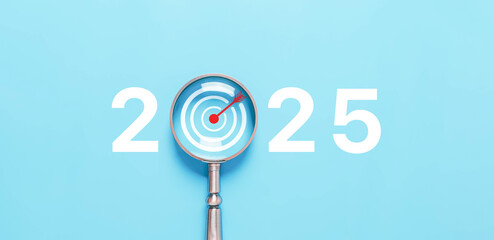 magnifying glass shows target 2025, action business plan for the new year's growth. concept of...