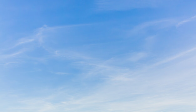 White clouds spread thinly in the blue sky