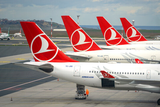 ISTANBUL - JAN 23: Row of planes with Turkish airlines logotype on surface at Havalimani Istanbul Airport on January 23.2024 in Turkey