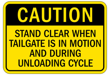 Obraz premium Truck warning sign and labels stand clear when tailgate is in motion and during unloading cycle
