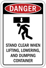 Truck warning sign and labels stand clear when lifting, lowering, and dumping container
