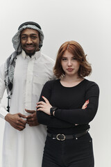 Muslim entrepreneur and a contemporary red-haired girl strike a pose together against a clean white background, embodying confidence, diversity, and a dynamic entrepreneurial spirit in their