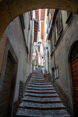Bellagio city narrow alley with cobbled steps in Lake Como italy