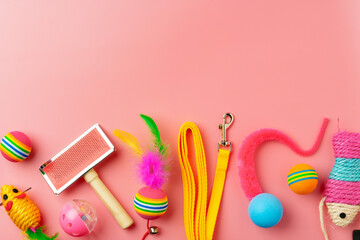 Pet toys on pink background studio shot