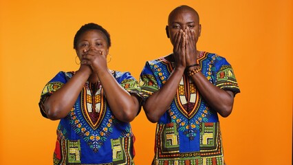 African american people doing three wise monkeys sign, covering their eyes, mouth and ears. Ethnic...