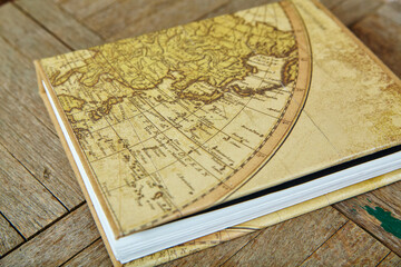 Vintage Eastern Hemisphere Map on Antique Book Cover, Rustic Wooden Texture