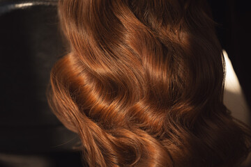 Detailed view of shiny auburn hair highlighting its natural waves and texture background - obrazy, fototapety, plakaty
