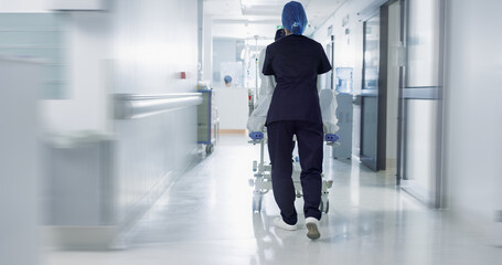 Patient, bed and nurse walking in hospital, hallway or corridor to surgery, operation room or ER...