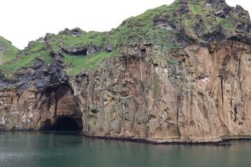 Fototapeta na wymiar Steep cliff on the coast of Heimaey island- Vestmannaeyjar- Westman Islands-Iceland 