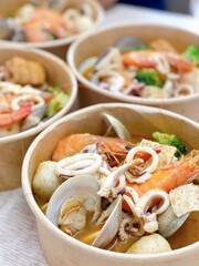 rice, beef, meat, dumpling, beer, snack and vegetables of Chinese food in diner