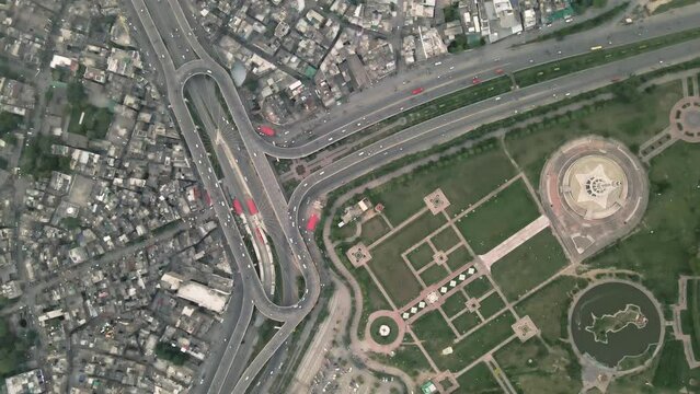 A top-down aerial shot of Aazadi Chowk, Lahore city.