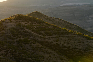 Golden Sunrise Over Desert Hills