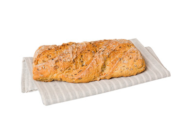 Freshly baked delicious french bread with napkin isolated on white background top view. Healthy white bread loaf