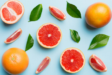 fresh Fruit grapefruit with Juicy grapefruit slices on colored background. Top view. Copy Space....