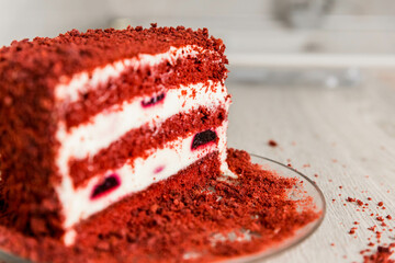 half of a red cake, side view 