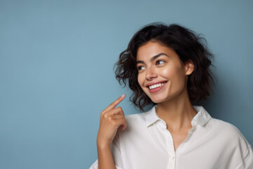 Young smiling  active woman with a hand gesture - obrazy, fototapety, plakaty