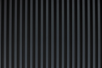 Dark gray striped background, wall on the street.